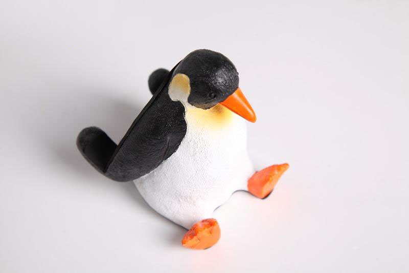 Penguin Sitting On The Ground Ipad Holder Phone Stand